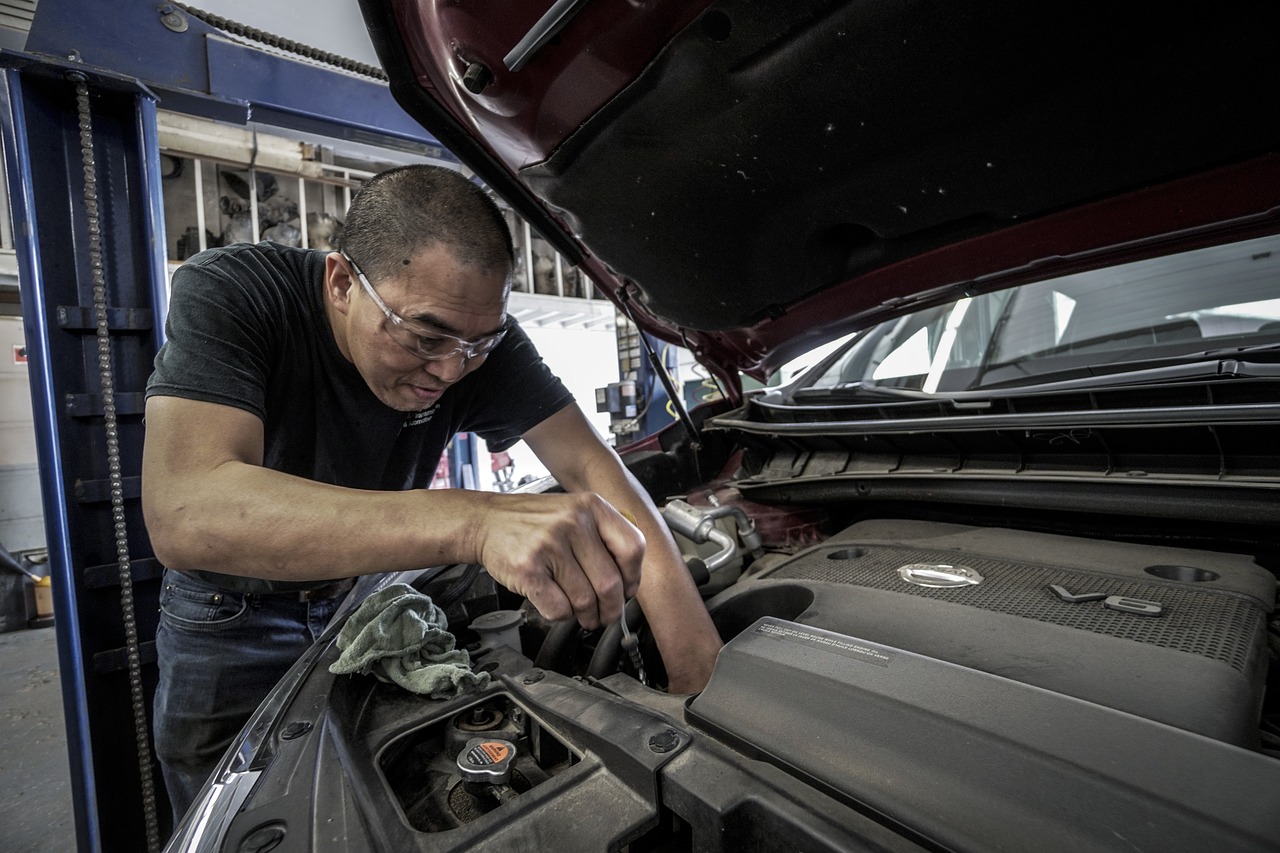 car engine repair in process by mechanic
