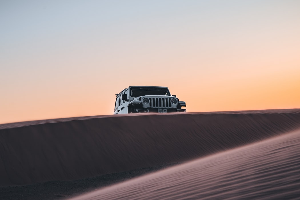 Jeep Wrangler off-roading over the horizon