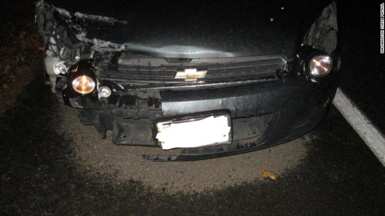 wrecked car using flashlights as headlights