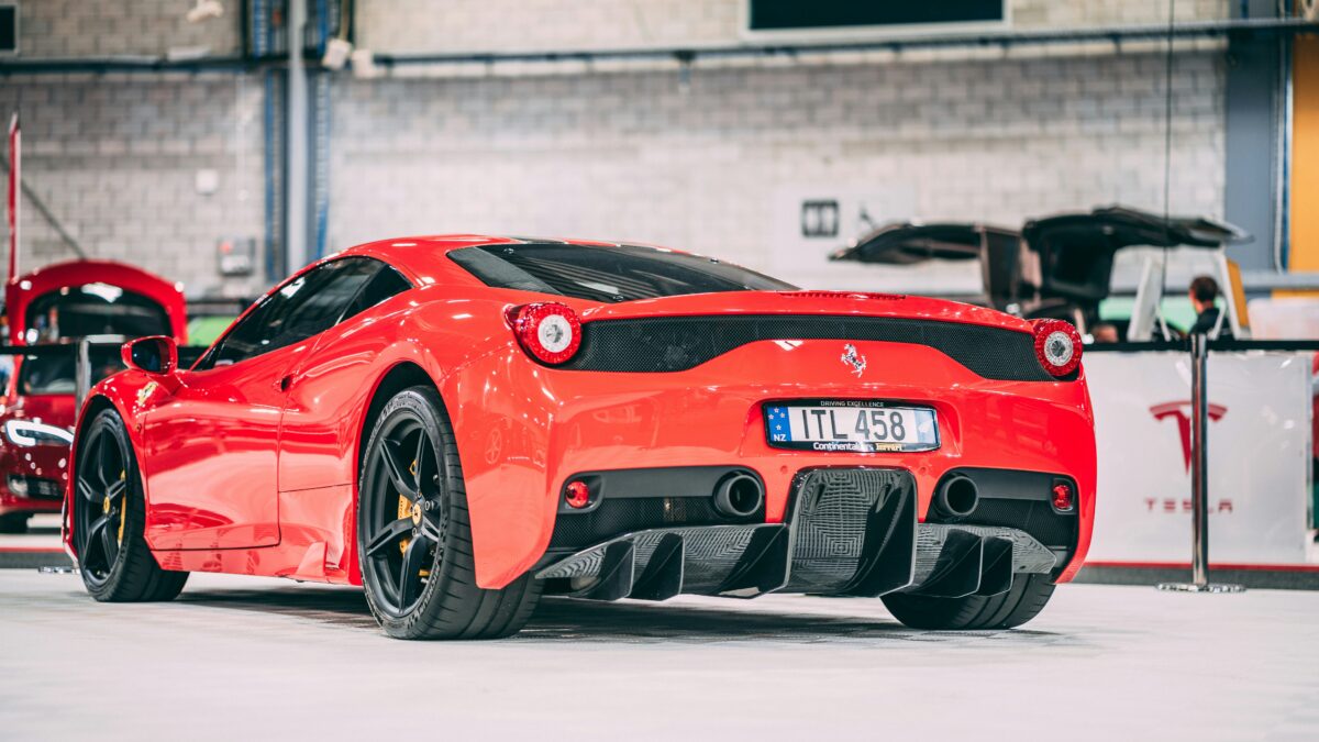 red Ferrari with manual transmission in showroom