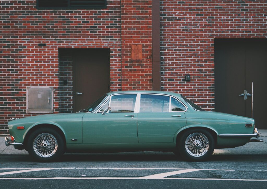best cars to restore; teal vintage Jaguar